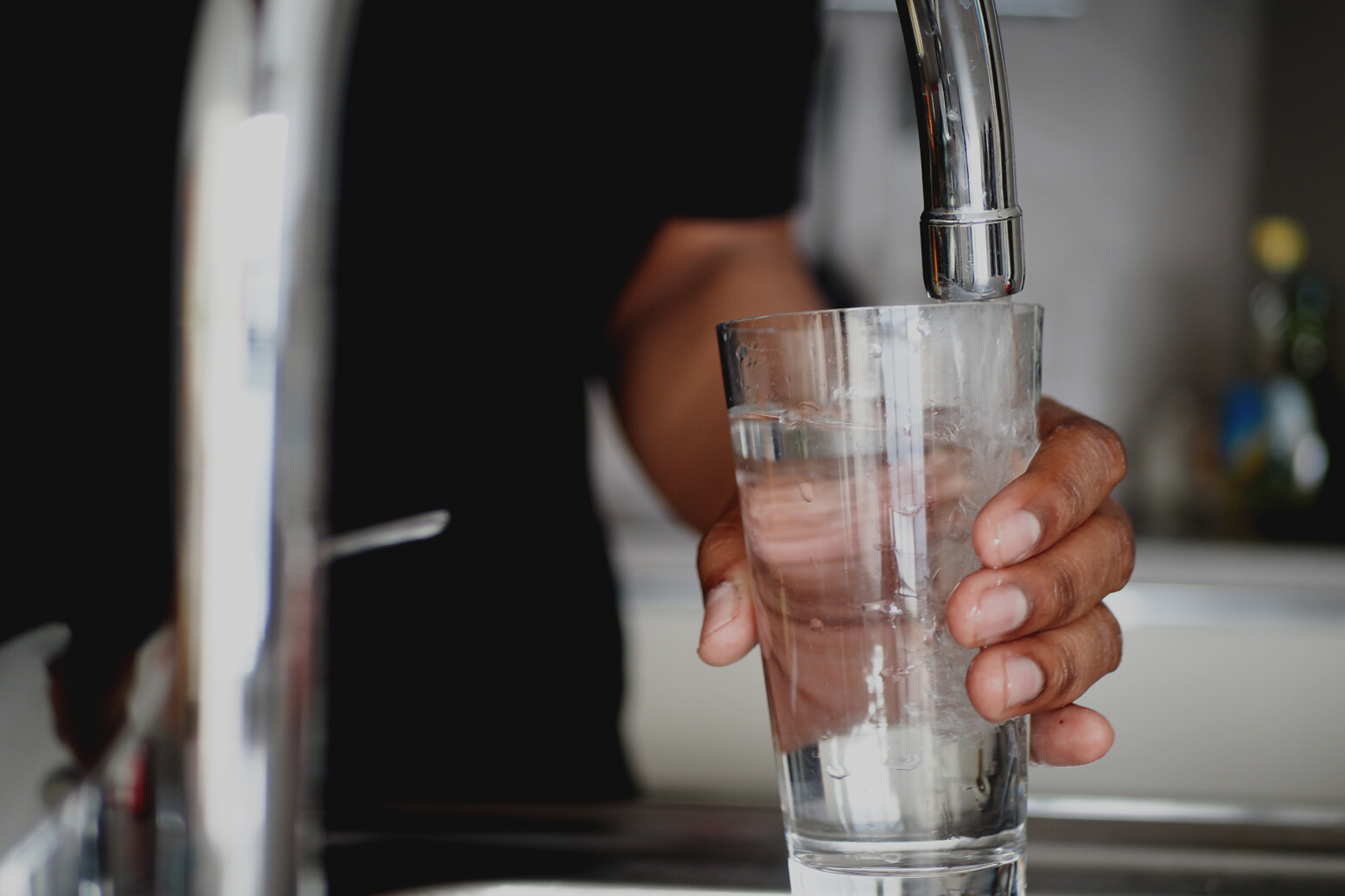 holding  glass of water